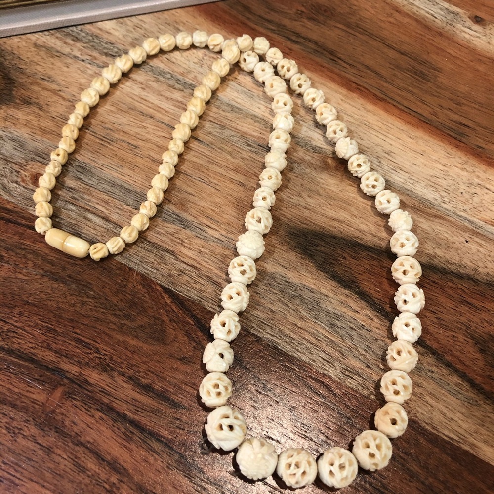 Carved bead necklace
